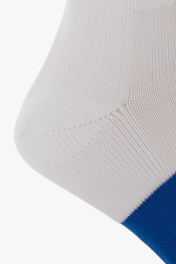 Marcelo Burlon White socks from . This pair features a geometric pattern, logo detail and ribbed cuffs