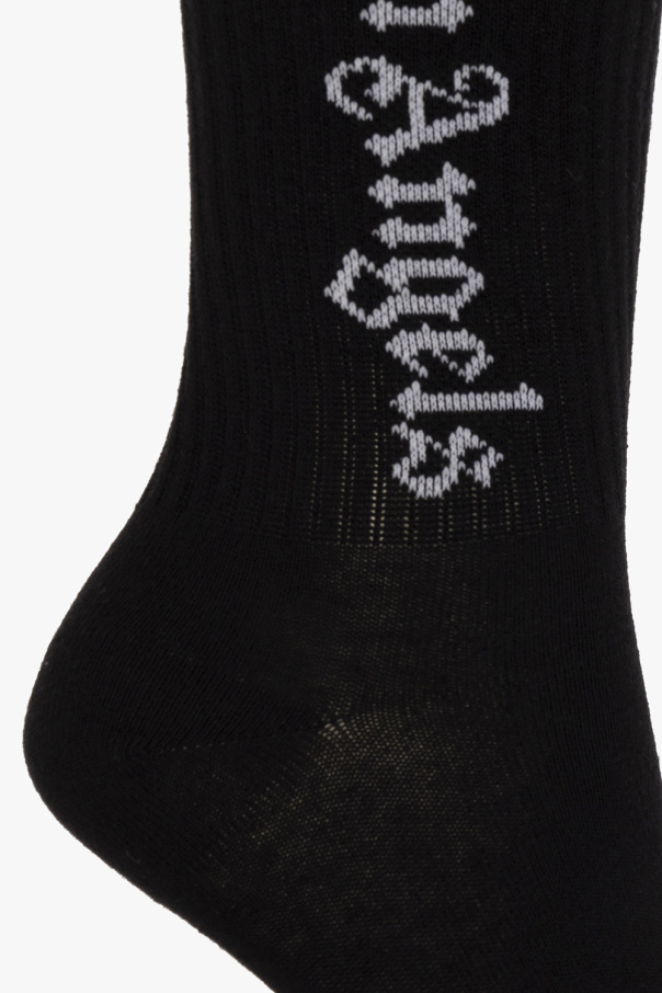 Palm Angels Kids Black socks from . Crafted from cotton, this pair features a white logo pattern and ribbed cuffs