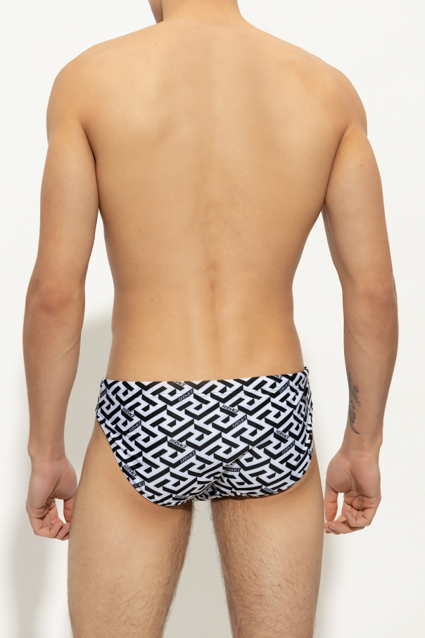 Versace Patterned swim embellished-trim shorts