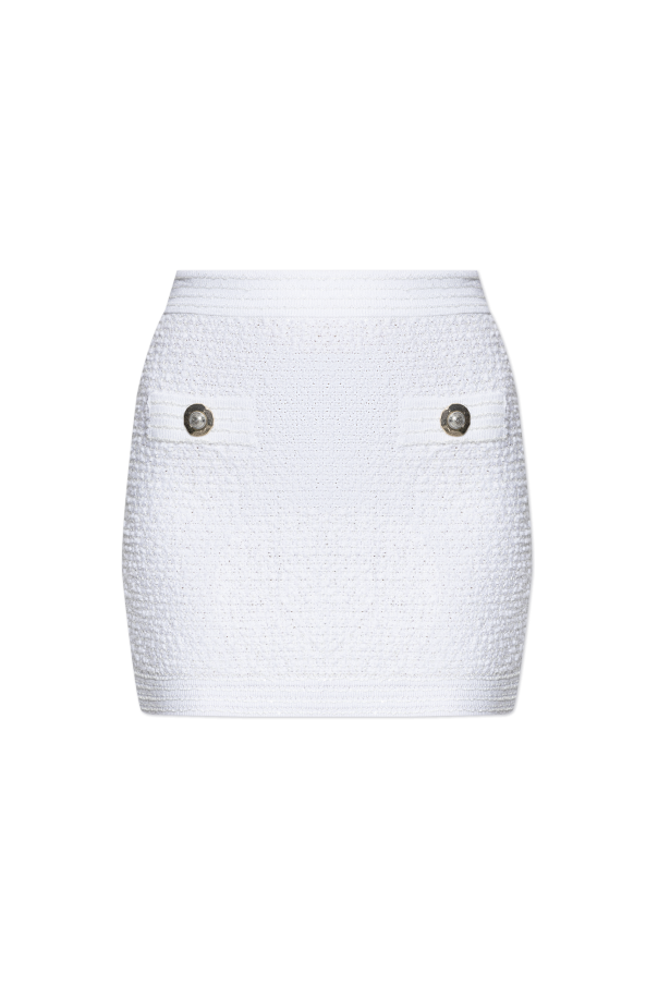 Short tweed skirt with appliqués od Balmain