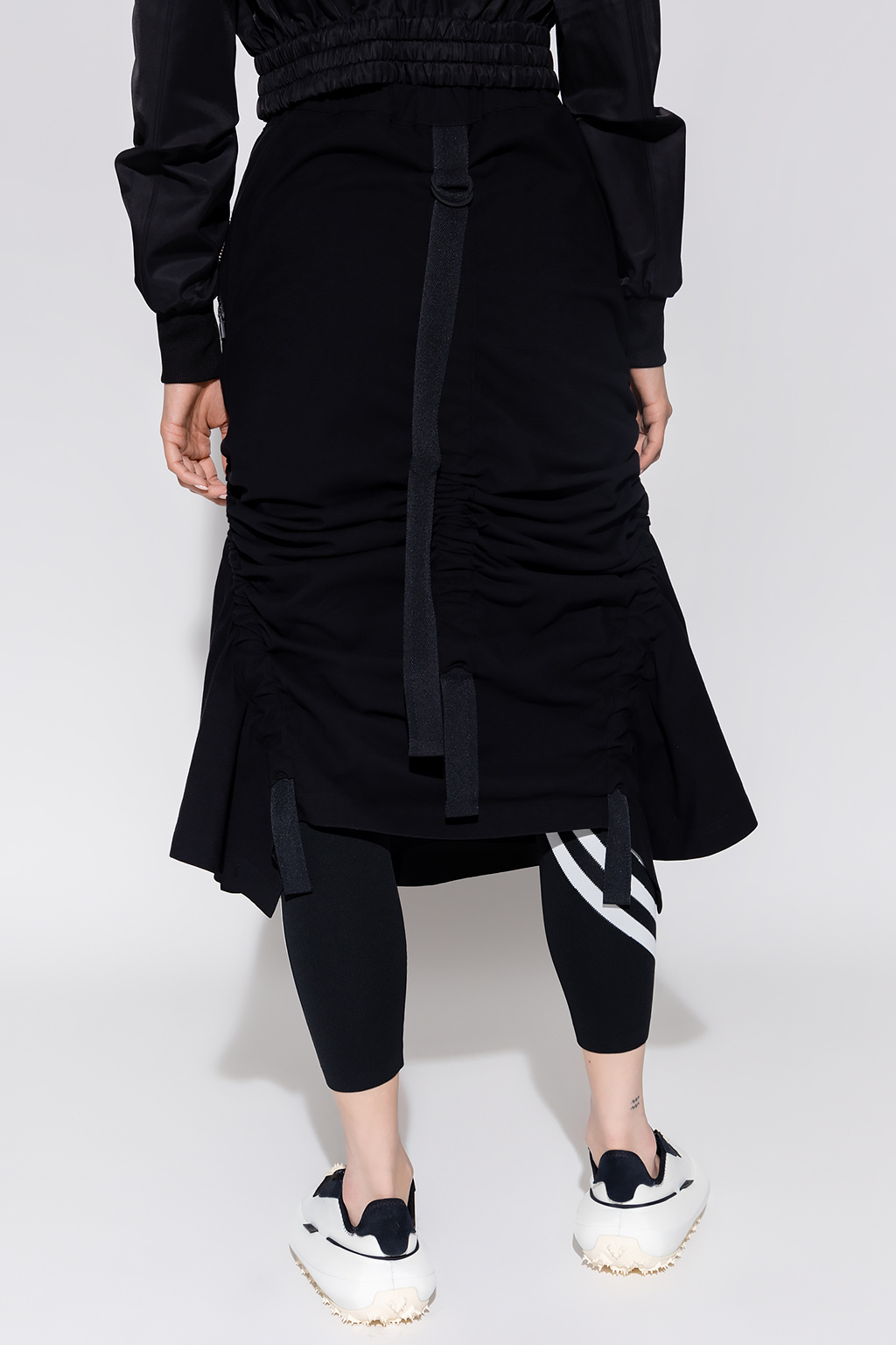 See a unique collaboration with Lacoste which blurs the lines between fashion and sport Asymmetrical skirt