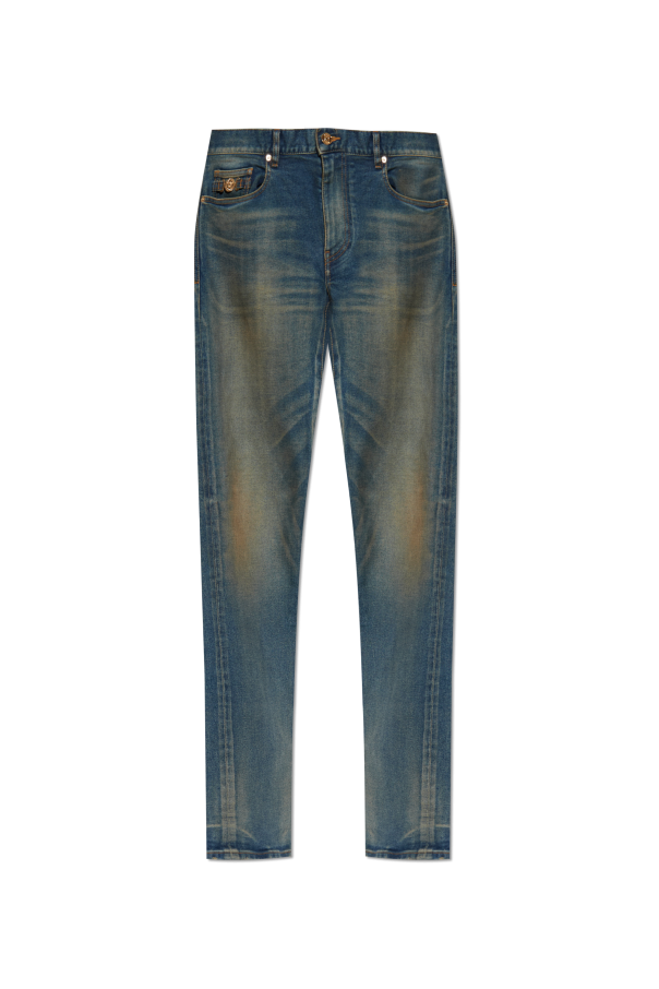 Jeans with `vintage` effect od Versace