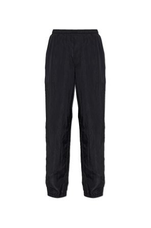 Trousers with sewn-in zippers in the legs