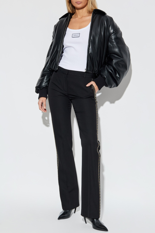Versace Creased trousers with studs