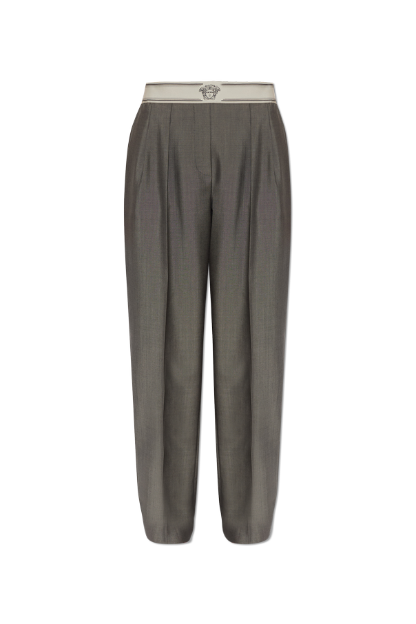 Creased trousers od Versace