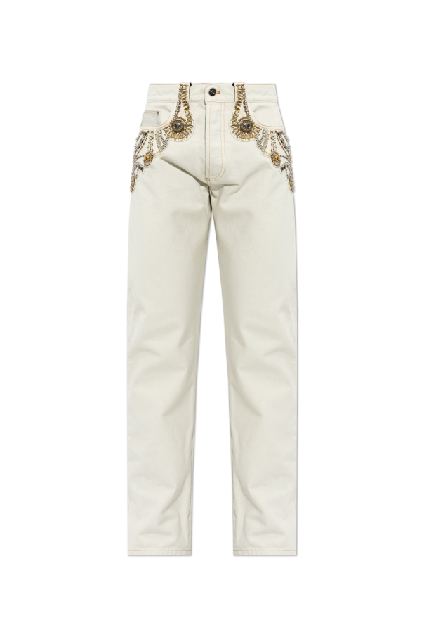 Jeans with appliqués od Versace