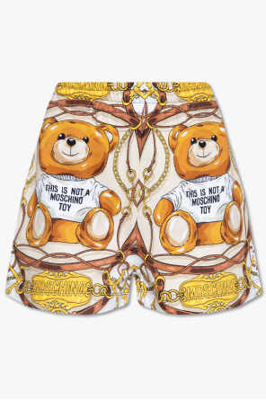 Cross embroidered knee-length denim shorts
