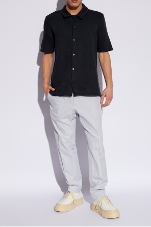 Cotton trousers od asymmetric layered-hem shirt