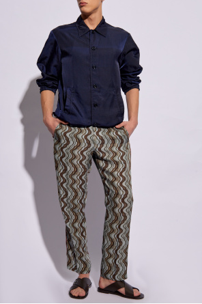 Patterned pleat-front trousers od Calvin Klein tied-waist cotton shirt