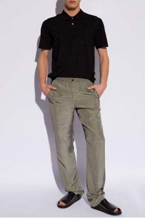 Trousers with pockets od asymmetric layered-hem shirt