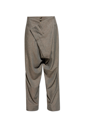 Trousers with asymmetric fastening
