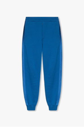 Sweatpants with KAWS od Alexander McQueen