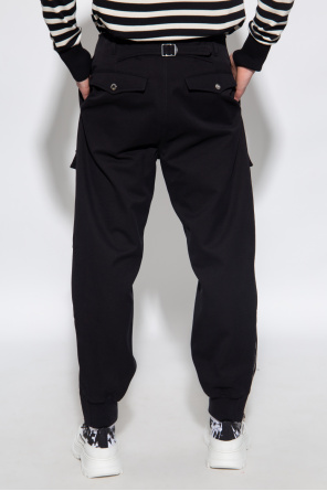 Alexander McQueen trousers style with multiple pockets