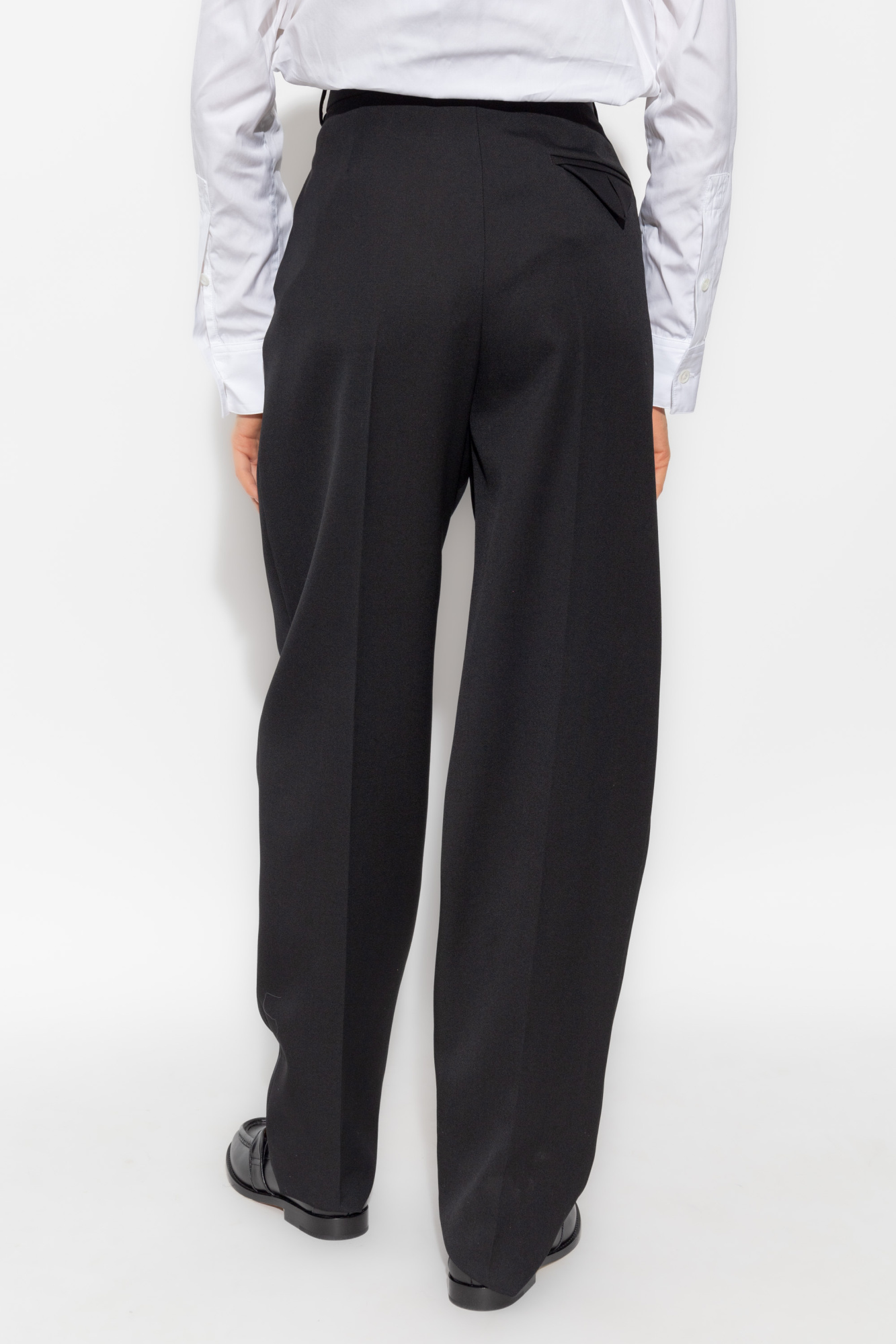Bottega Veneta® Women's Curved Shape Wool Pants in Black. Shop online now.