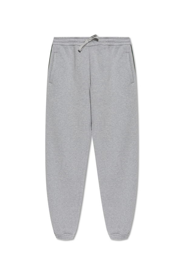 Sweatpants with characteristic Web stripe od Gucci