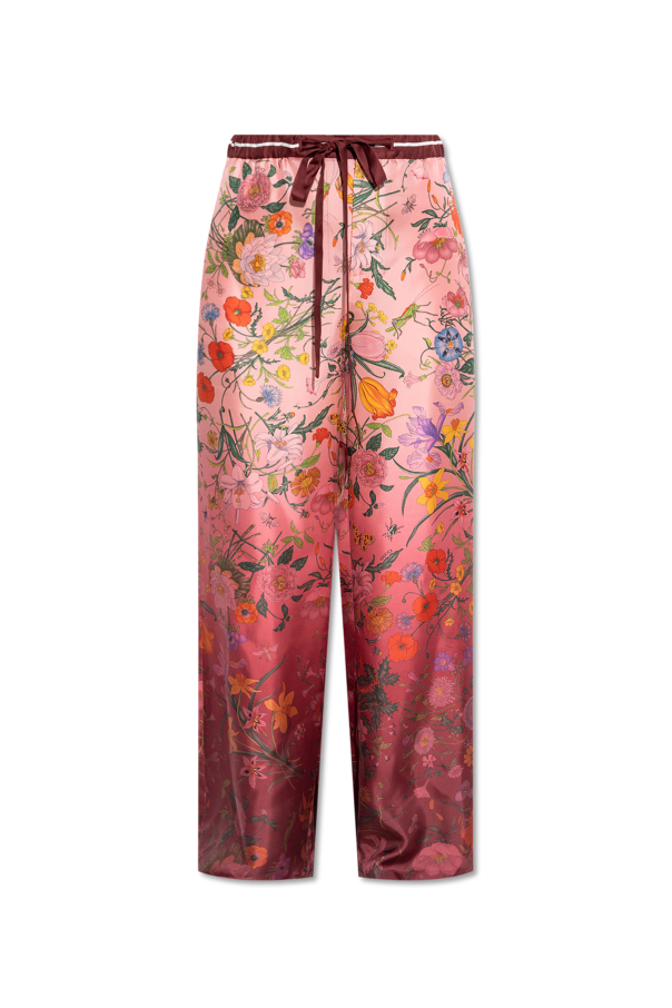 Silk trousers with a floral motif od Gucci