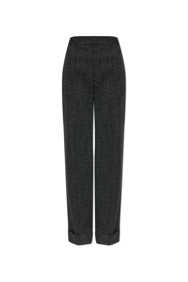 Wool trousers with pintuck detailing on the legs od Alexander McQueen