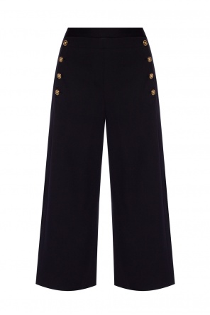 Trousers with decorative buttons od Versace