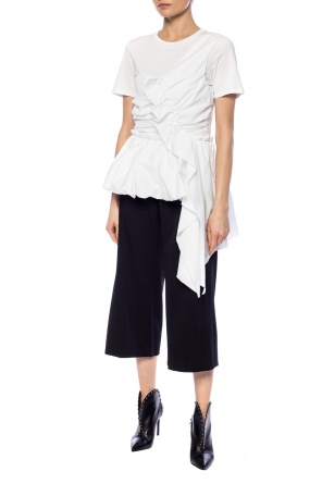 Trousers with decorative buttons od Versace