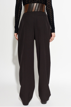 Alaïa Calças com detalhes em pele na cintura