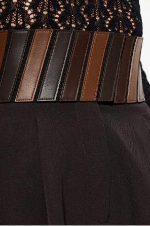 Alaïa Calças com detalhes em pele na cintura