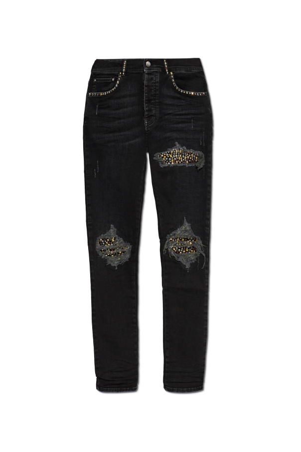 Jeans with shimmering appliqués od Amiri