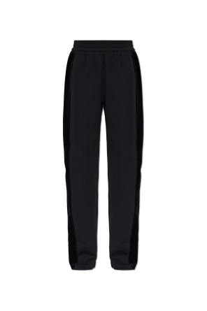 Trousers with side stripes and a velvet finish