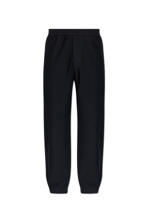 Perforated trousers with embroidered logo