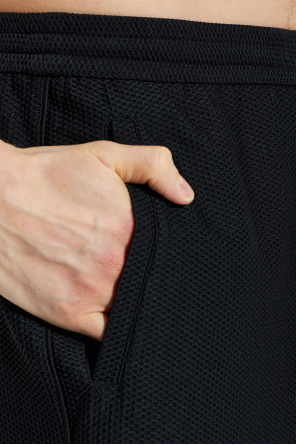 Giorgio Armani Perforated trousers with embroidered logo