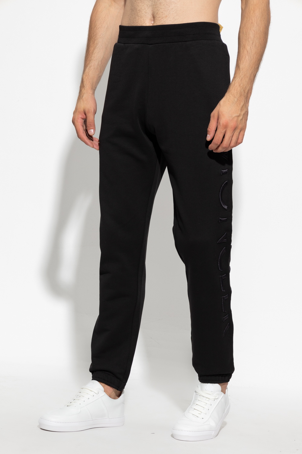 Moncler Add some retro flare to your athleisure looks with these classic navy track pants from