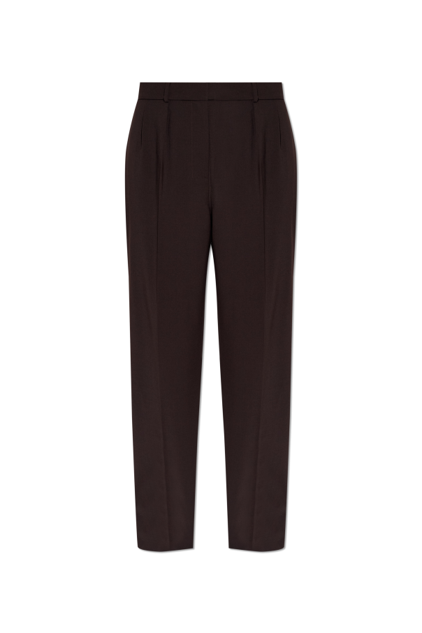 Creased trousers od Lacoste