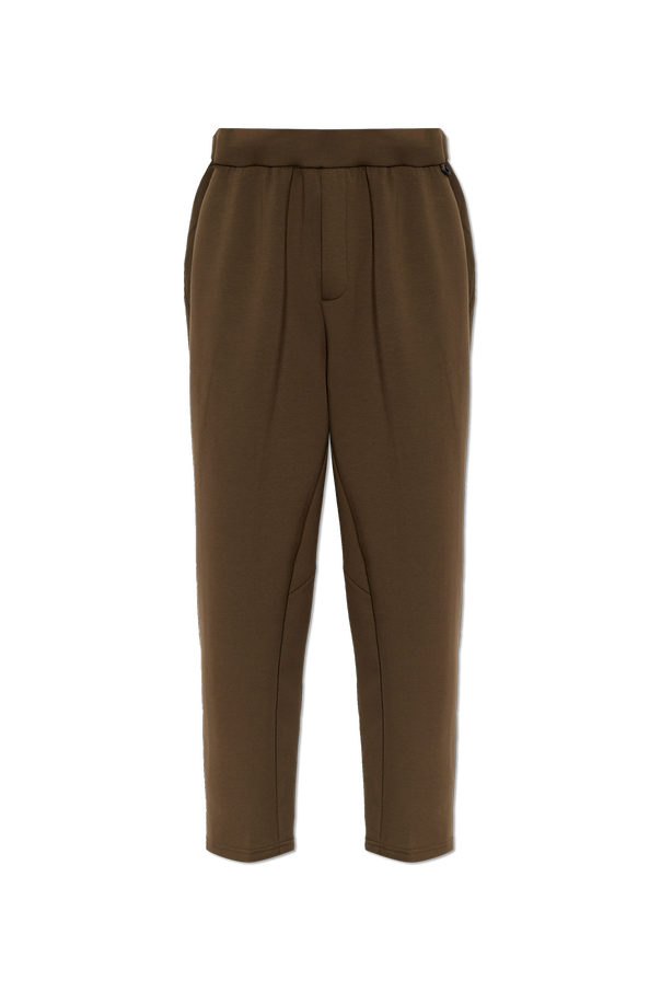 Brown Nike track pants in a dark olive-brown shade od Nike