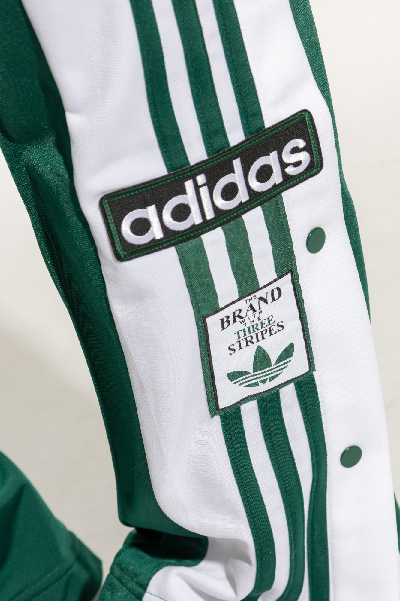 the brand with the three stripes sweatpants