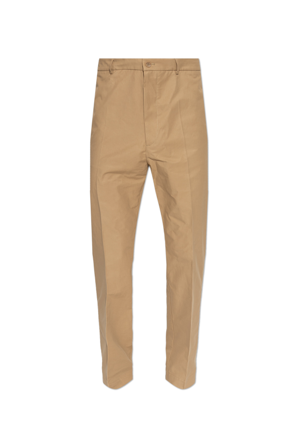 Creased trousers od Moncler