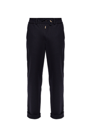 Trousers with rolled-up legs