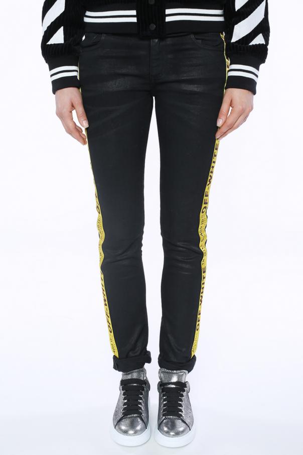 black jeans with yellow stripe