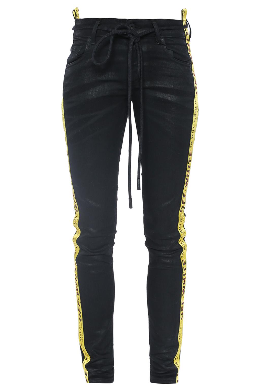black jeans with yellow stripe