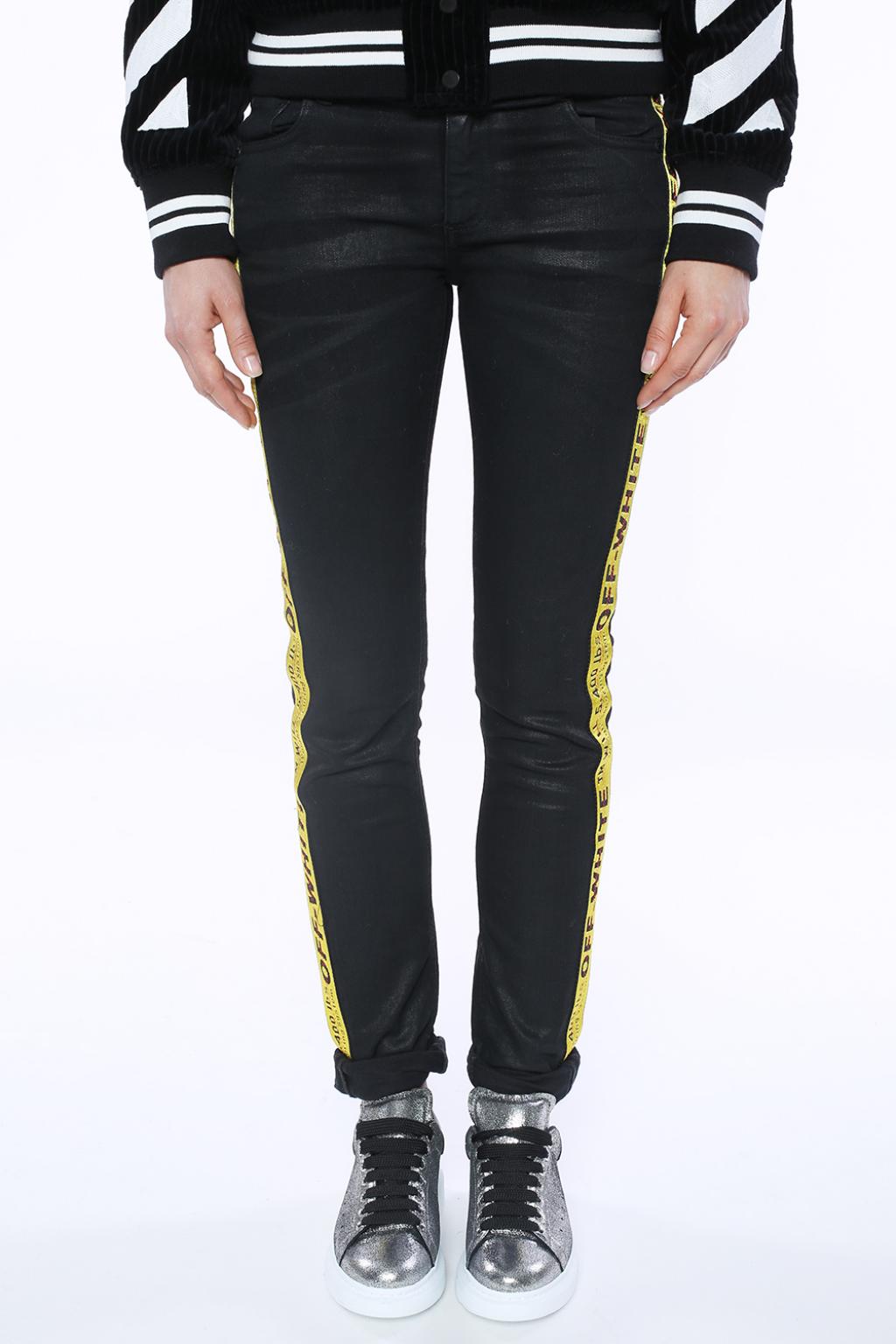 black jeans with white side stripe