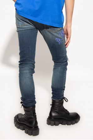 Amiri Distressed skinny jeans