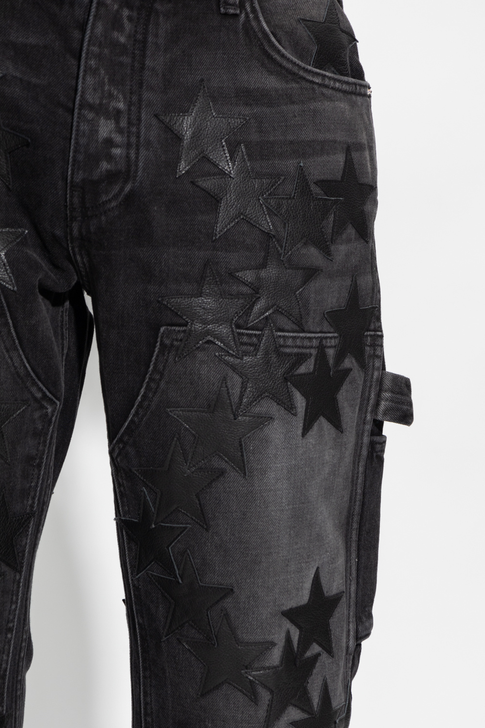 Amiri Jeans with star-shaped patches