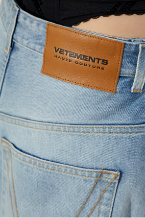 VETEMENTS Jeans with train