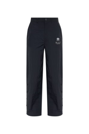 Trousers with buttons on the legs