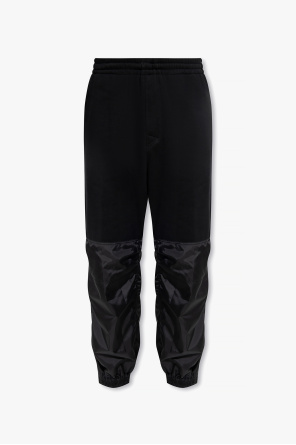 Sweatpants in contrasting fabrics od Undercover