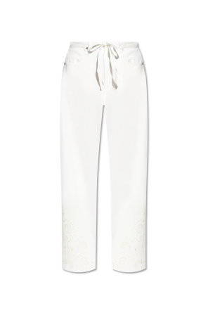 Trousers with openwork finishing