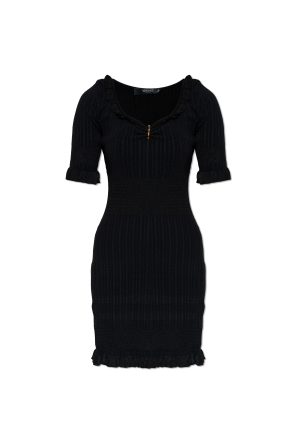 Dress with decorative safety pin