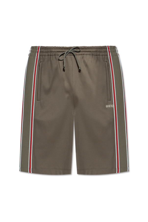 Shorts with a characteristic `Web` belt od Gucci
