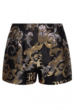 Add some edge to your swimwear collection with these black and white swim shorts from
