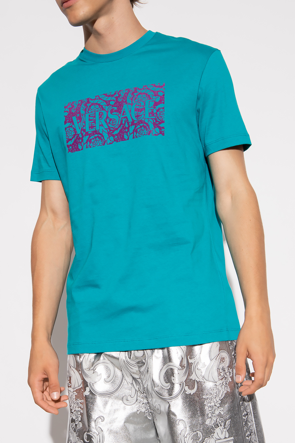 Versace COLLUSION Unisex T-shirt met lange mouwen en logoprint in roestkleur