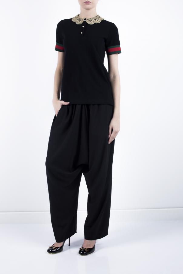 black gucci polo with red and green collar