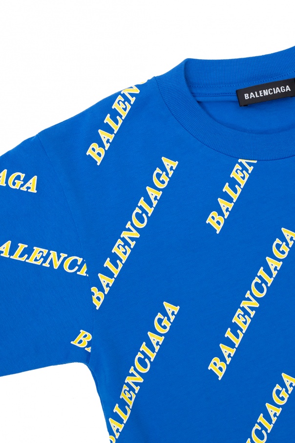Balenciaga Kids Het shirt is een kort model en valt boven de broek